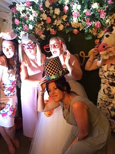 Group of Wedding guests having fun in the Vintage Selfie Pod